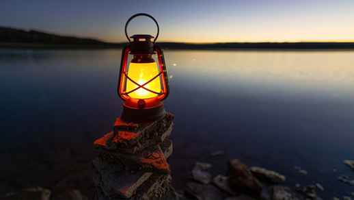 Lantern on the lake shore - Live Windows Background