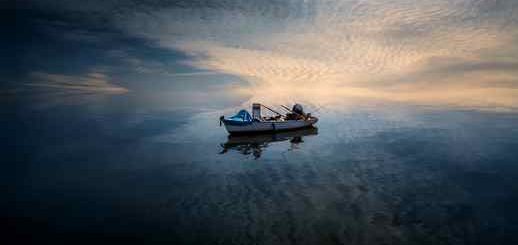 Calm Sea Water Ripples Fishing Boat 4K - Desktop Theme