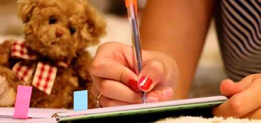 Girl Writing in Notepad | Teddy Bear